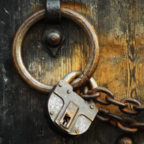 Heavy wooden doors with chains and padlocks are all about security